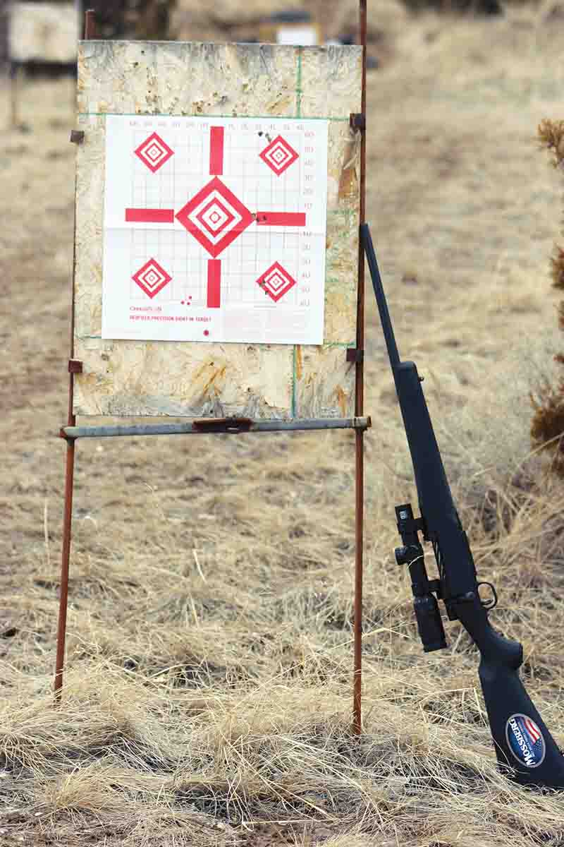 The first step in shooting at longer ranges is checking the accuracy of your scope’s adjustments by shooting a “tall target” test at shorter ranges. This target was shot at 50 yards, where the one-foot distance between the bottom and top groups is sufficient for shooting to 1,000 yards for most appropriate rounds.